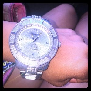 This is a stainless steel Geneva platinum watch